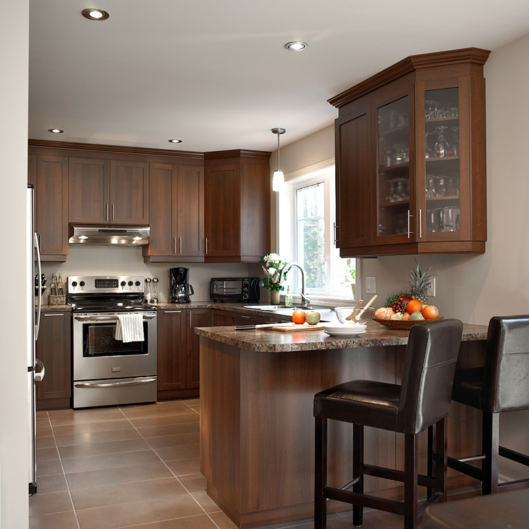 Cuisines Beauregard |Transitional style kitchen with decorative glass cabinet doors